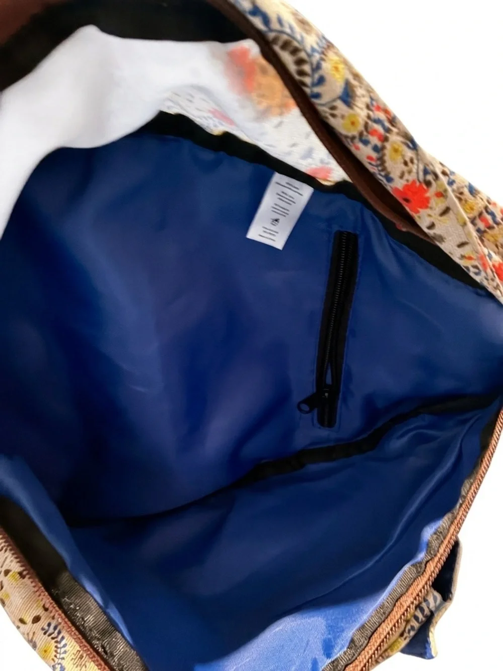 Kavu Cream Floral Rope Sling Backpack with Coral Accents